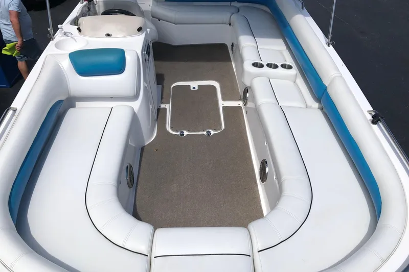 Slide: The Image of 2014 Hurricane SunDeck Sport 201 IO boat interior with white and blue seating. - 16