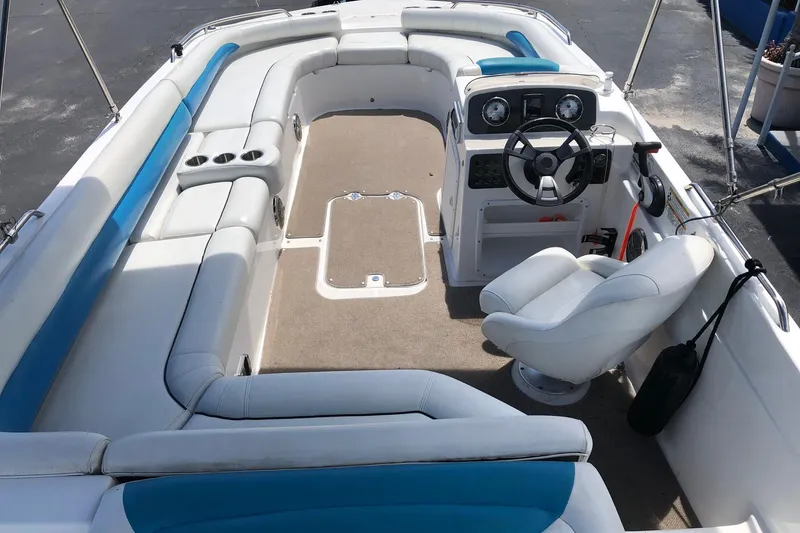 Slide: The Image of 2014 Hurricane SunDeck Sport 201 IO boat interior with seating and steering console. - 19