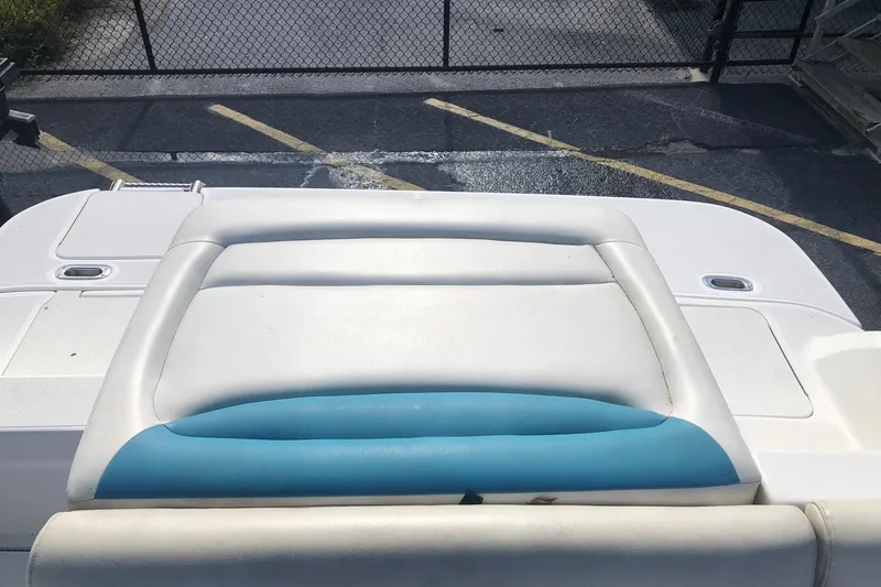 Slide: The Image of 2014 Hurricane SunDeck Sport 201 IO boat with white and blue seating. - 5