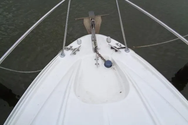 Slide: The Image of Bow of 2000 Bayliner 2455 Ciera Sunbridge with anchor and railing. - 11
