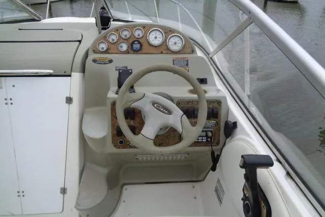 Slide: The Image of Cockpit of 2000 Bayliner 2455 Ciera Sunbridge with steering wheel and instrument panel. - 12