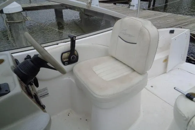 Slide: The Image of Cockpit of 2000 Bayliner 2455 Ciera Sunbridge with steering wheel and captain's chair. - 14