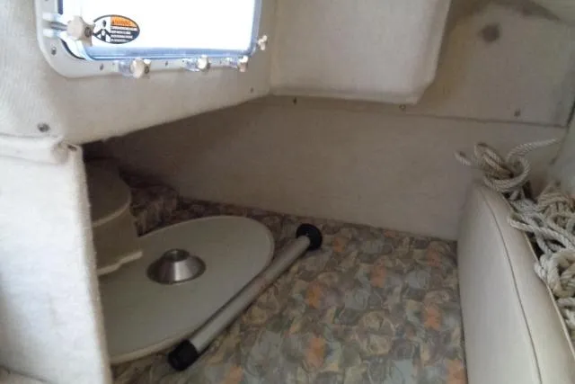 Slide: The Image of Interior cabin of 2000 Bayliner 2455 Ciera Sunbridge with table and seating area. - 33