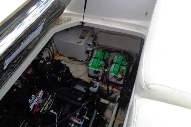 Slide: The Image of Engine compartment of a 2000 Bayliner 2455 Ciera Sunbridge with visible batteries and wiring. - 38