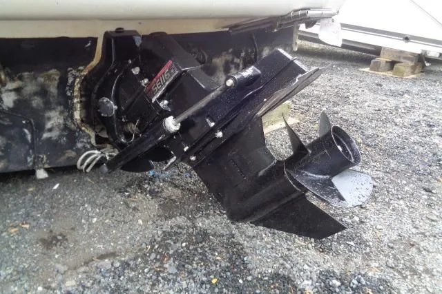Slide: The Image of Bayliner 2455 Ciera Sunbridge 2000 boat stern drive on gravel surface. - 39