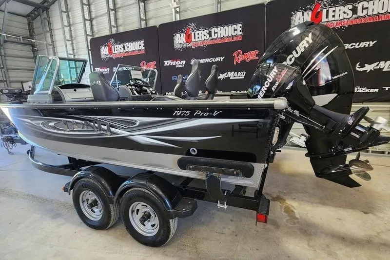 Slide: The Image of 2011 Lund 1975 Pro-V SE fishing boat with Mercury engine in showroom. - 4
