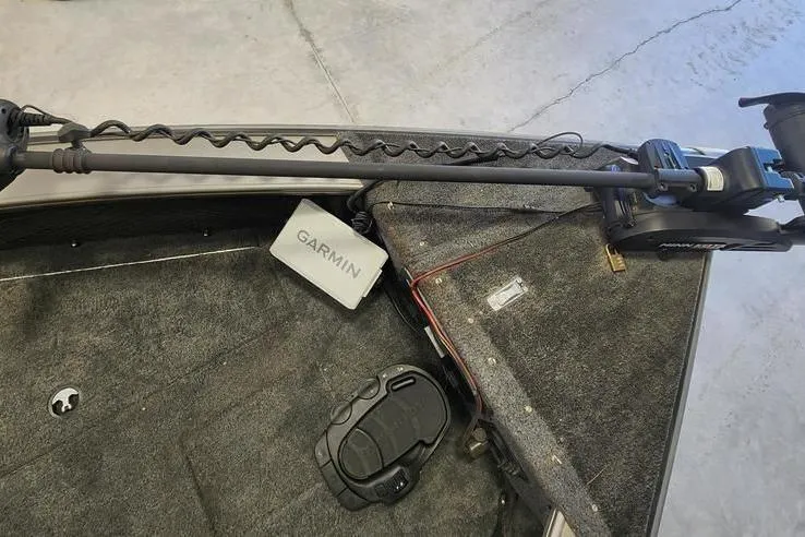 Slide: The Image of Interior of a 2011 Lund 1975 Pro-V SE boat with Garmin equipment. - 7