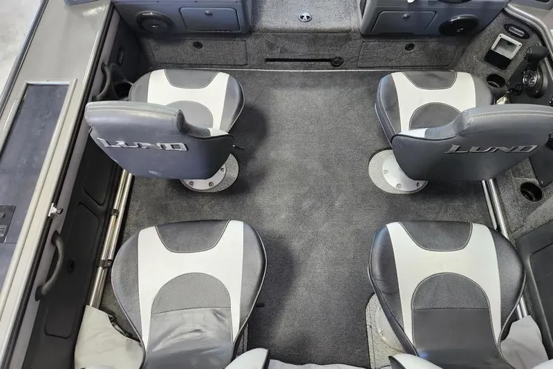 Slide: The Image of Interior of a 2011 Lund 1975 Pro-V SE boat with four seats. - 8