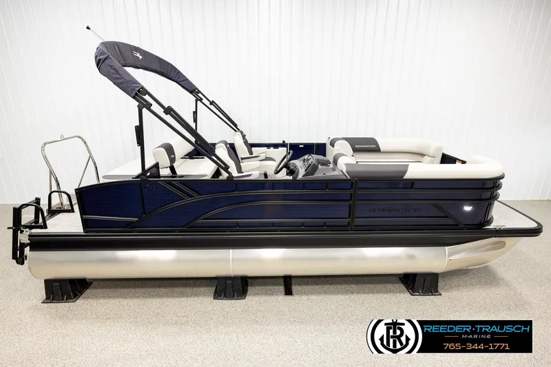 The Image of 2026 Bennington 22 SSBSF pontoon boat in showroom, featuring sleek design and comfortable seating. - 1