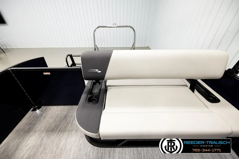 Slide: The Image of 2026 Bennington 22 SSBSF boat interior with sleek seating design in showroom. - 15