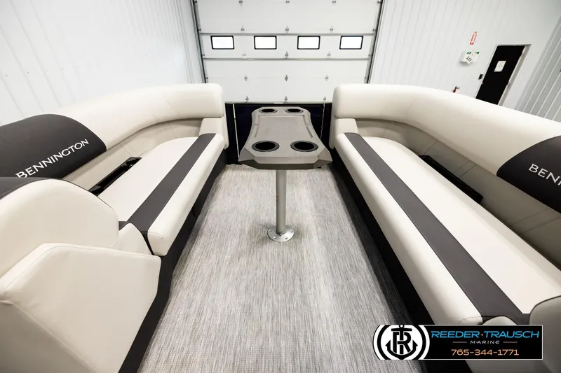 Slide: The Image of 2026 Bennington 22 SSBSF boat interior with plush seating and central table. - 19