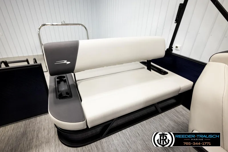 Slide: The Image of 2026 Bennington 22 SSBSF boat seat with cup holders in a showroom setting. - 22