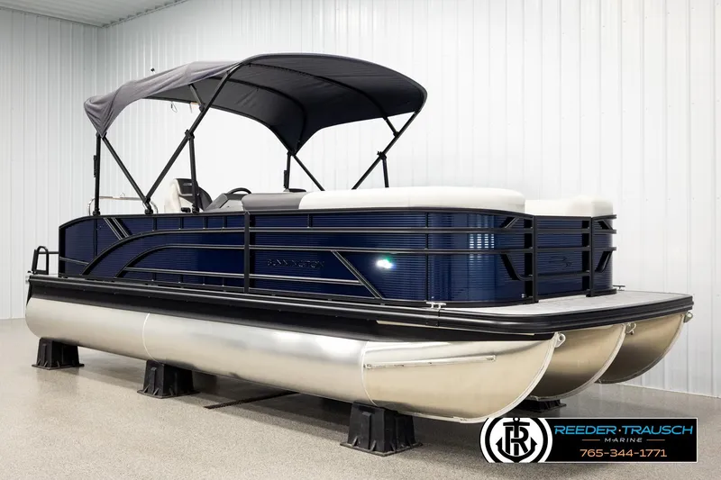 Slide: The Image of 2026 Bennington 22 SSBSF pontoon boat with canopy in showroom. - 3