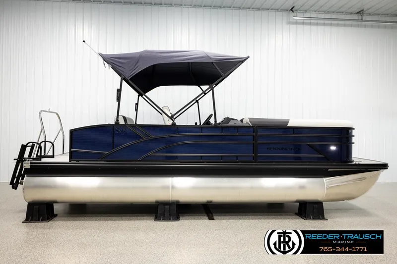 Slide: The Image of 2026 Bennington 22 SSBSF pontoon boat with canopy in showroom. - 5