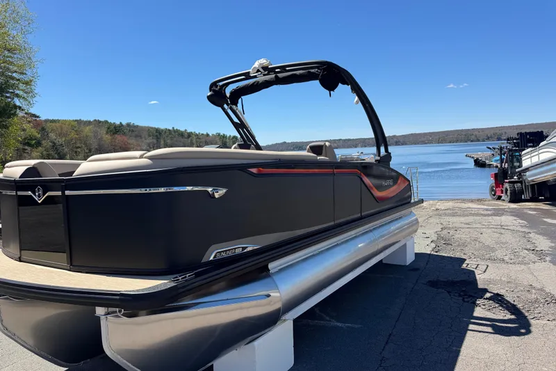 Slide: The Image of 2026 Harris Sunliner 230 Sport pontoon boat by a serene lake. - 12