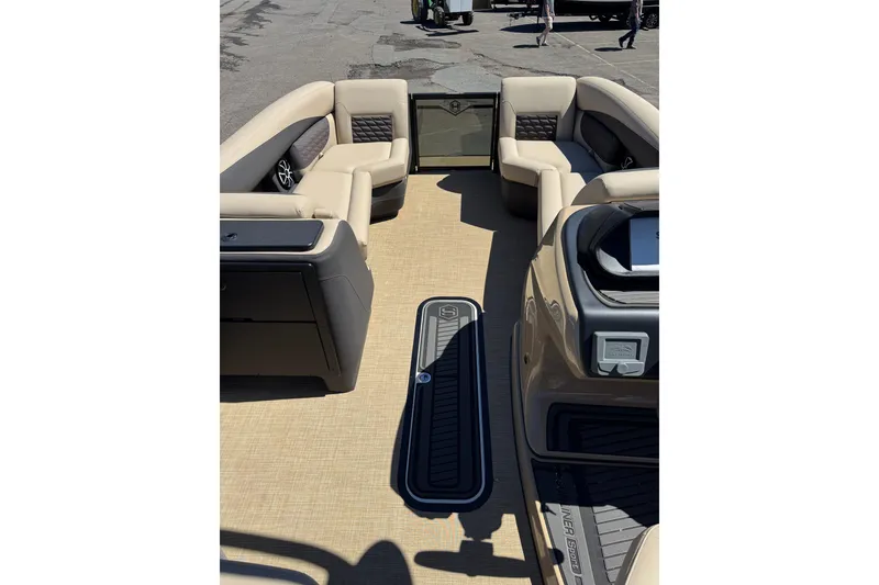 Slide: The Image of Interior view of 2026 Harris Sunliner 230 Sport pontoon boat with beige seating. - 7