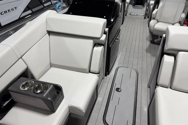 Slide: The Image of Luxurious interior of 2025 Balise Horizon 24 boat with sleek seating and cup holders. - 11