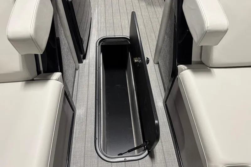 Slide: The Image of Open storage compartment in 2025 Balise Horizon 24 boat interior with cushioned seating. - 13