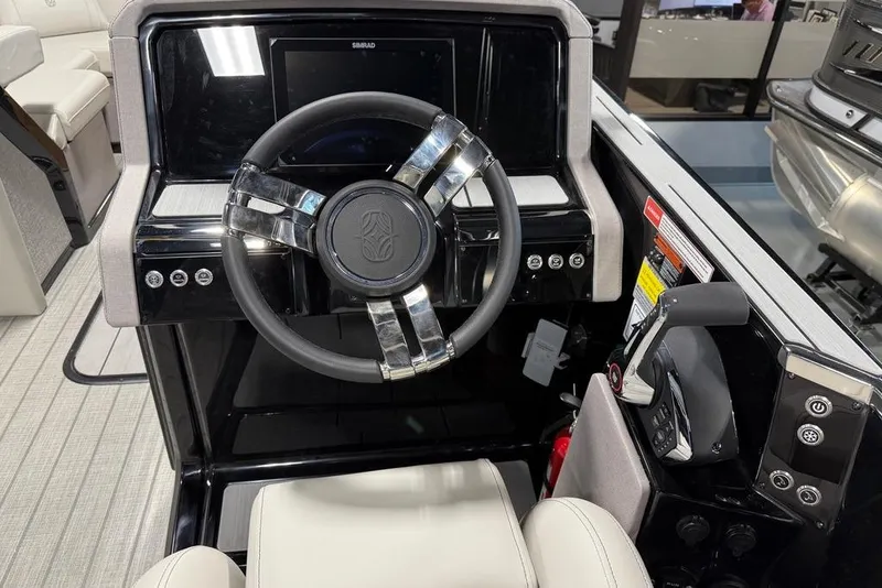 Slide: The Image of Steering console of 2025 Balise Horizon 24 boat with modern controls and display. - 18