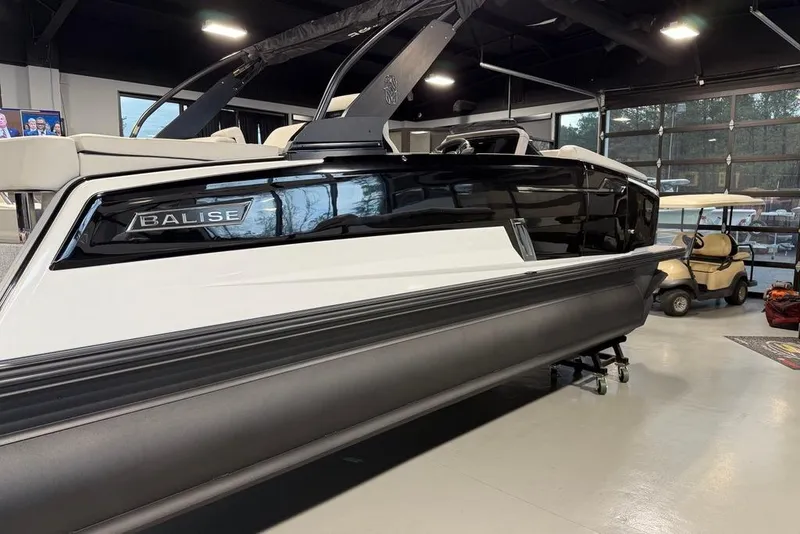 Slide: The Image of 2025 Balise Horizon 24 boat displayed indoors, showcasing sleek design and modern features. - 7