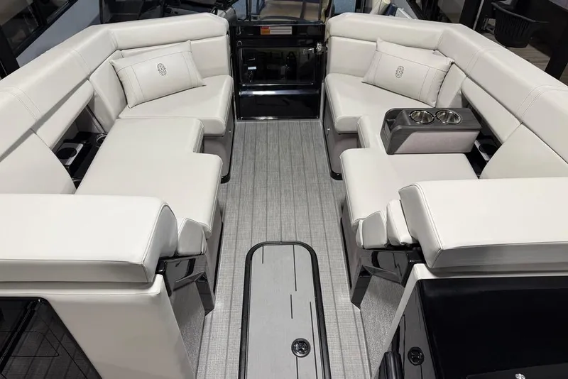 Slide: The Image of Luxurious interior of 2025 Balise Horizon 24 boat with plush seating and cup holders. - 8
