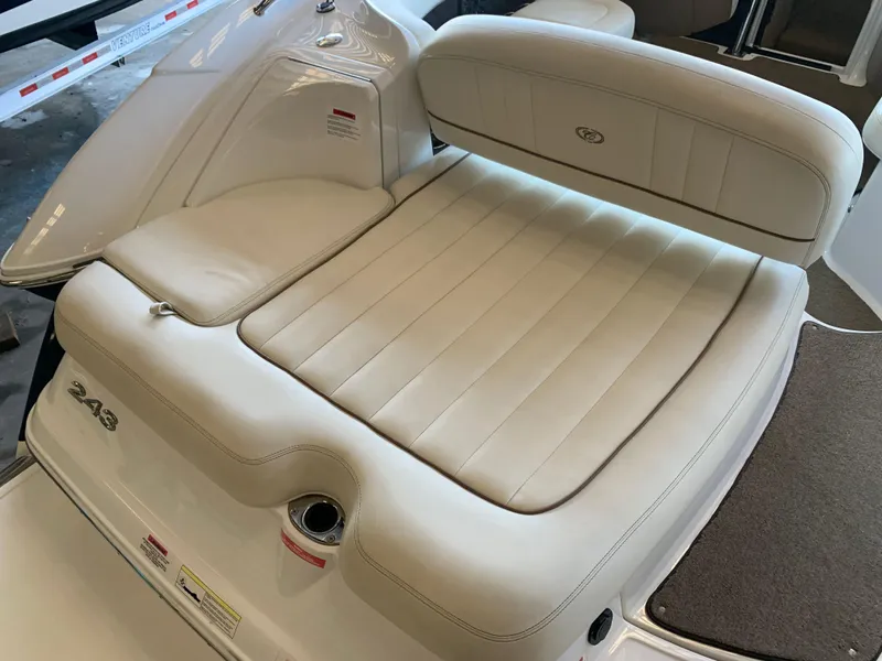 Slide: The Image of 2015 Cobalt 243 boat with beige upholstered seating. - 11