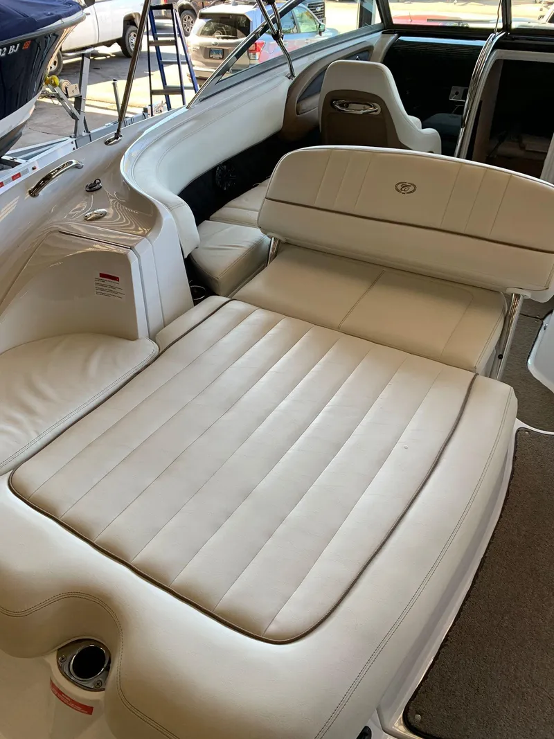 Slide: The Image of Interior of a 2015 Cobalt 243 boat with beige upholstery. - 12