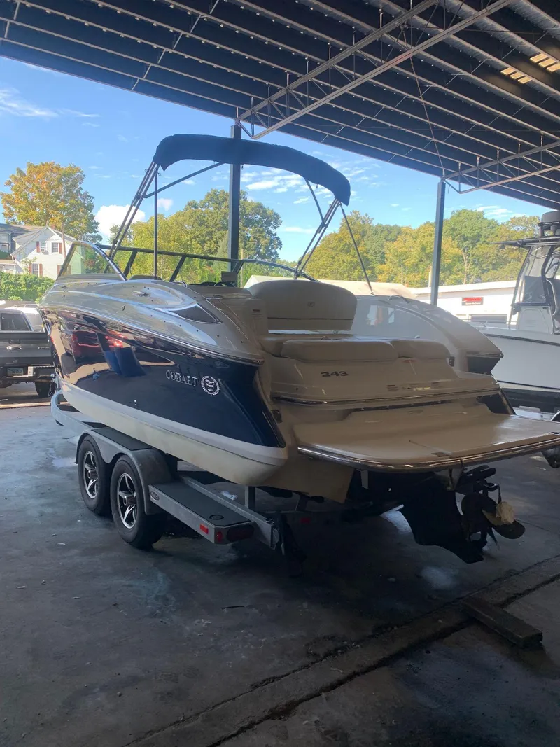 Slide: The Image of 2015 Cobalt 243 boat parked in a storage facility. - 2
