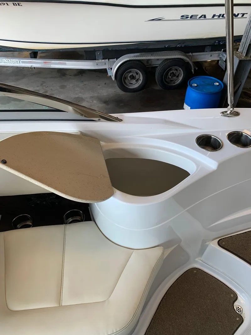 Slide: The Image of Interior view of a 2015 Cobalt 243 boat with storage compartment. - 20