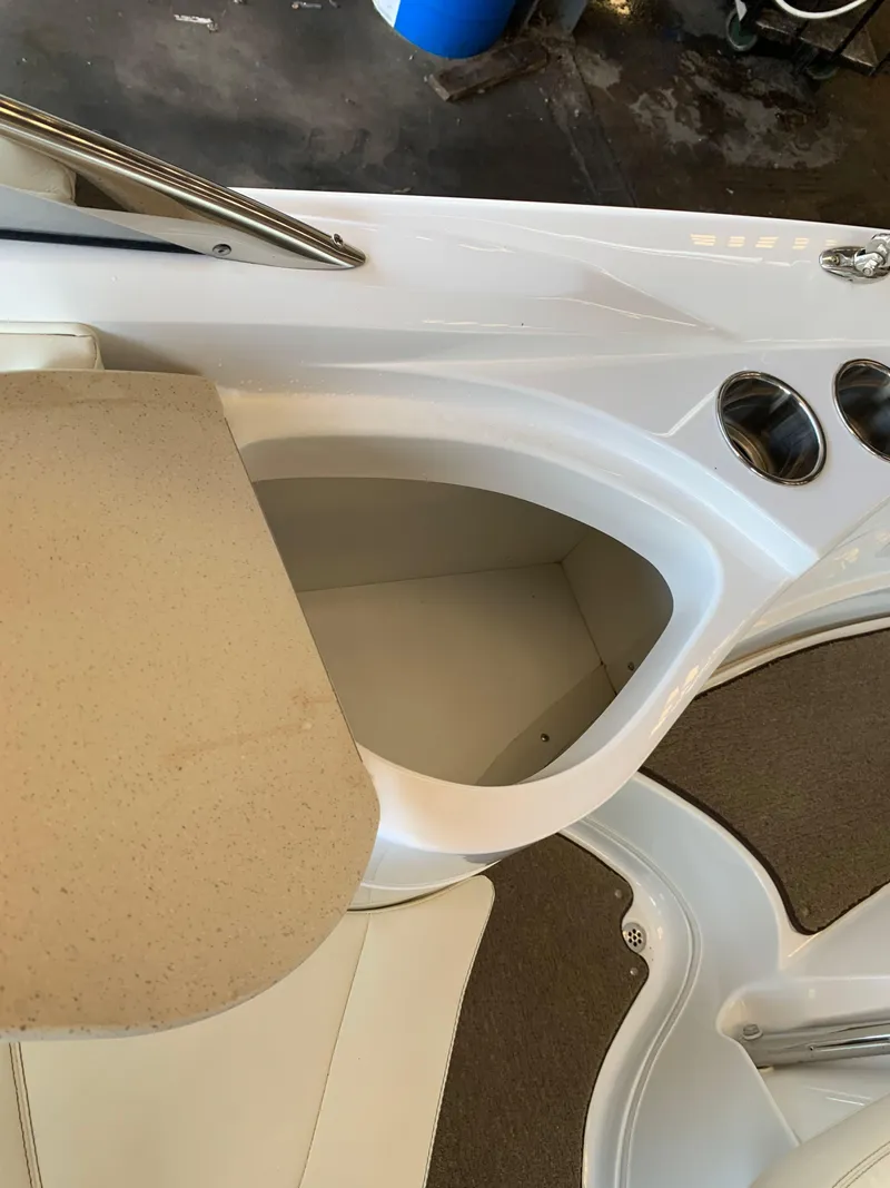 Slide: The Image of 2015 Cobalt 243 boat interior with cup holders. - 21