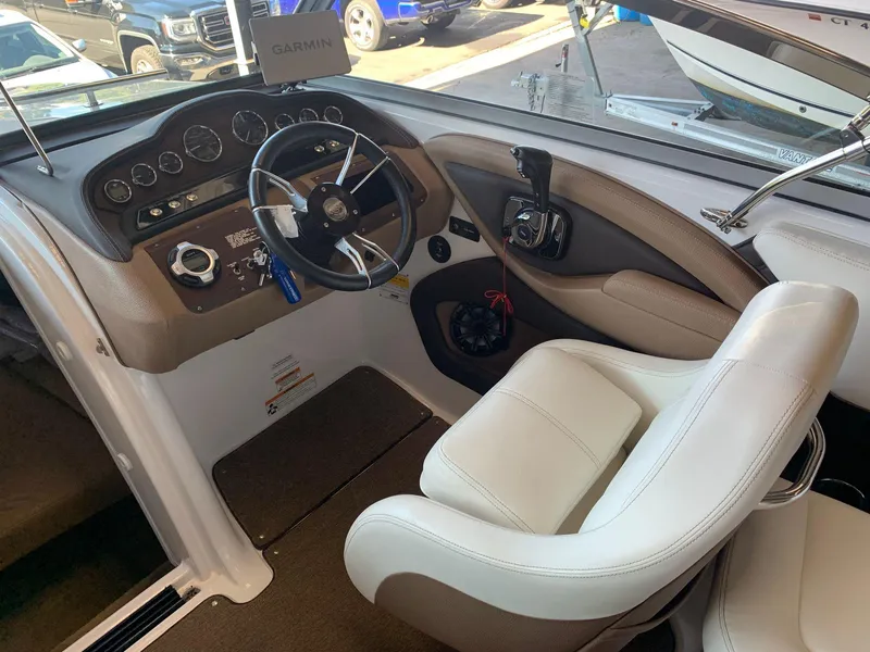 Slide: The Image of Interior of a 2015 Cobalt 243 boat with steering console. - 24
