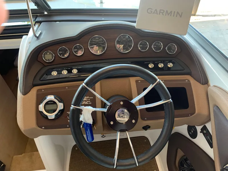 Slide: The Image of Dashboard of a 2015 Cobalt 243 boat with Garmin navigation system. - 27