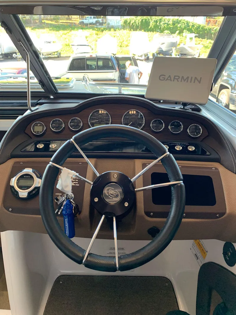 Slide: The Image of 2015 Cobalt 243 boat helm with Garmin navigation system. - 29