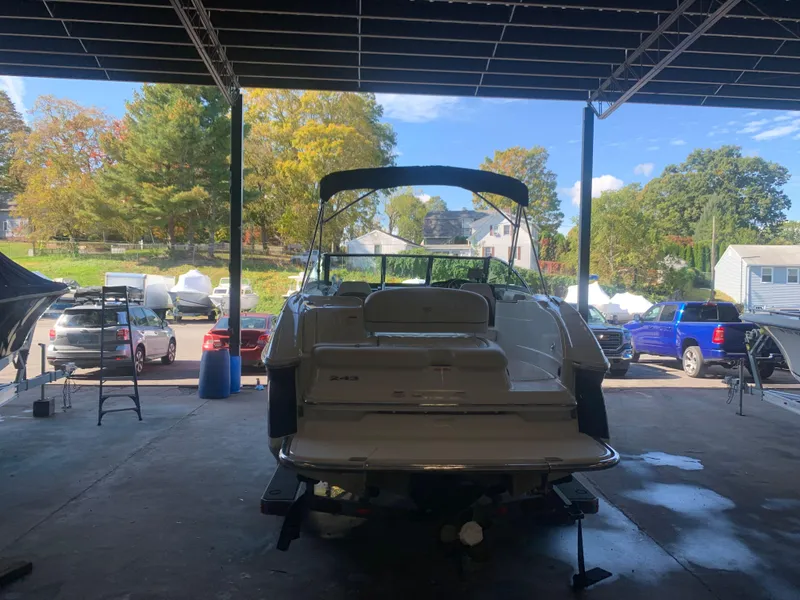 Slide: The Image of 2015 Cobalt 243 boat in a covered storage area. - 3