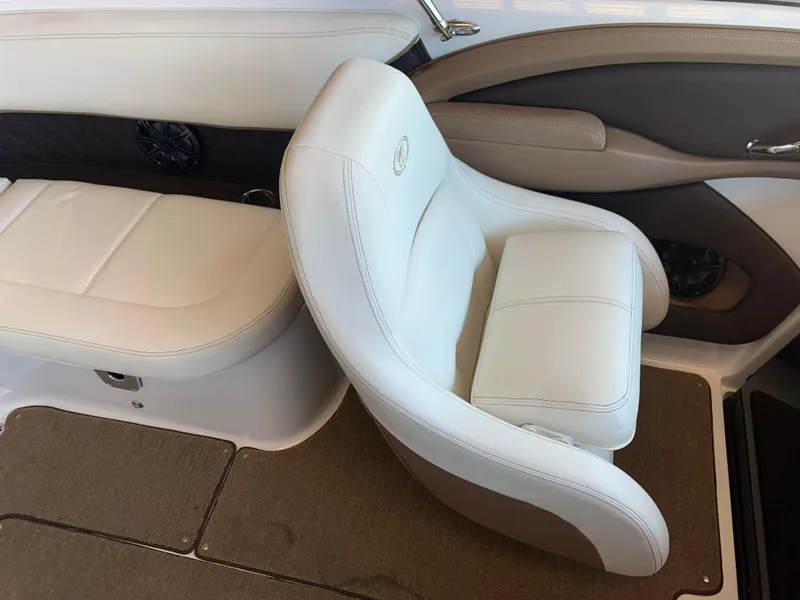 Slide: The Image of Interior of a 2015 Cobalt 243 boat with beige leather seats. - 36