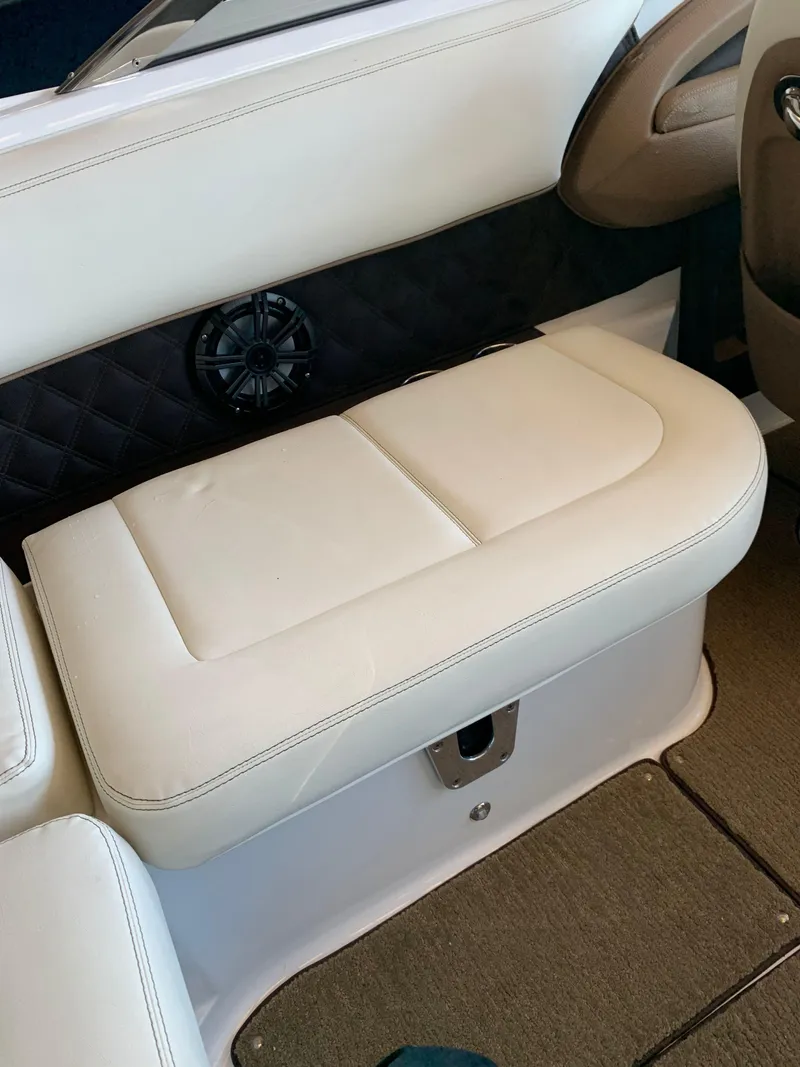 Slide: The Image of Interior of a 2015 Cobalt 243 boat with white seating. - 37