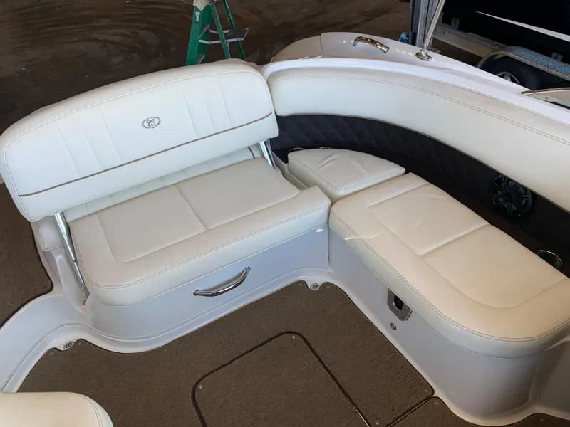 Slide: The Image of Interior of a 2015 Cobalt 243 boat with white leather seating. - 39