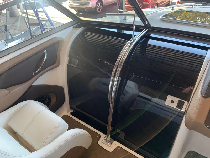 Slide: The Image of Interior of a 2015 Cobalt 243 boat with white seating. - 40