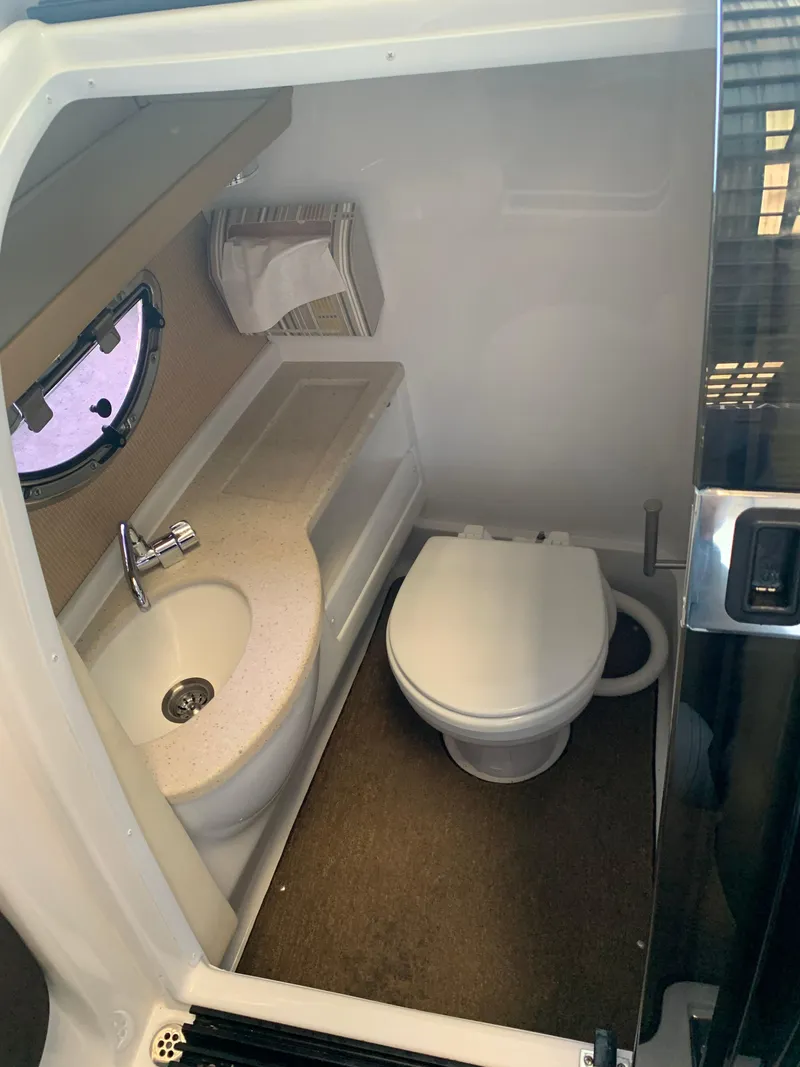Slide: The Image of Interior of a Cobalt 243 yacht, bathroom with toilet and sink. - 41