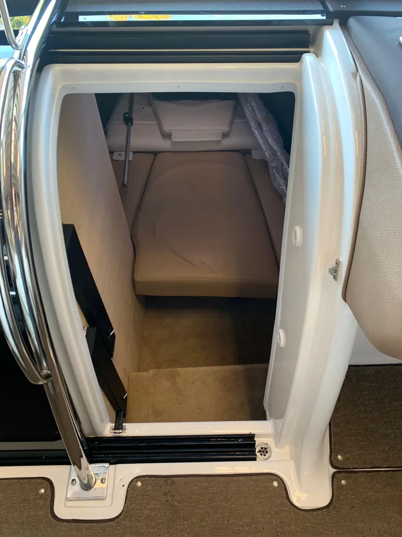 Slide: The Image of Interior of a 2015 Cobalt 243 boat cabin with padding. - 46