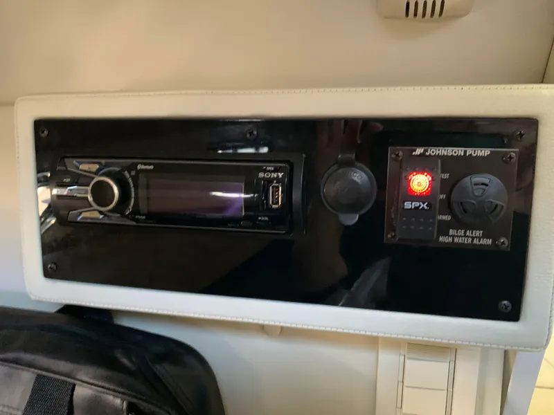 Slide: The Image of Dashboard of a Cobalt 243 boat with Sony radio and Johnson pump. - 49