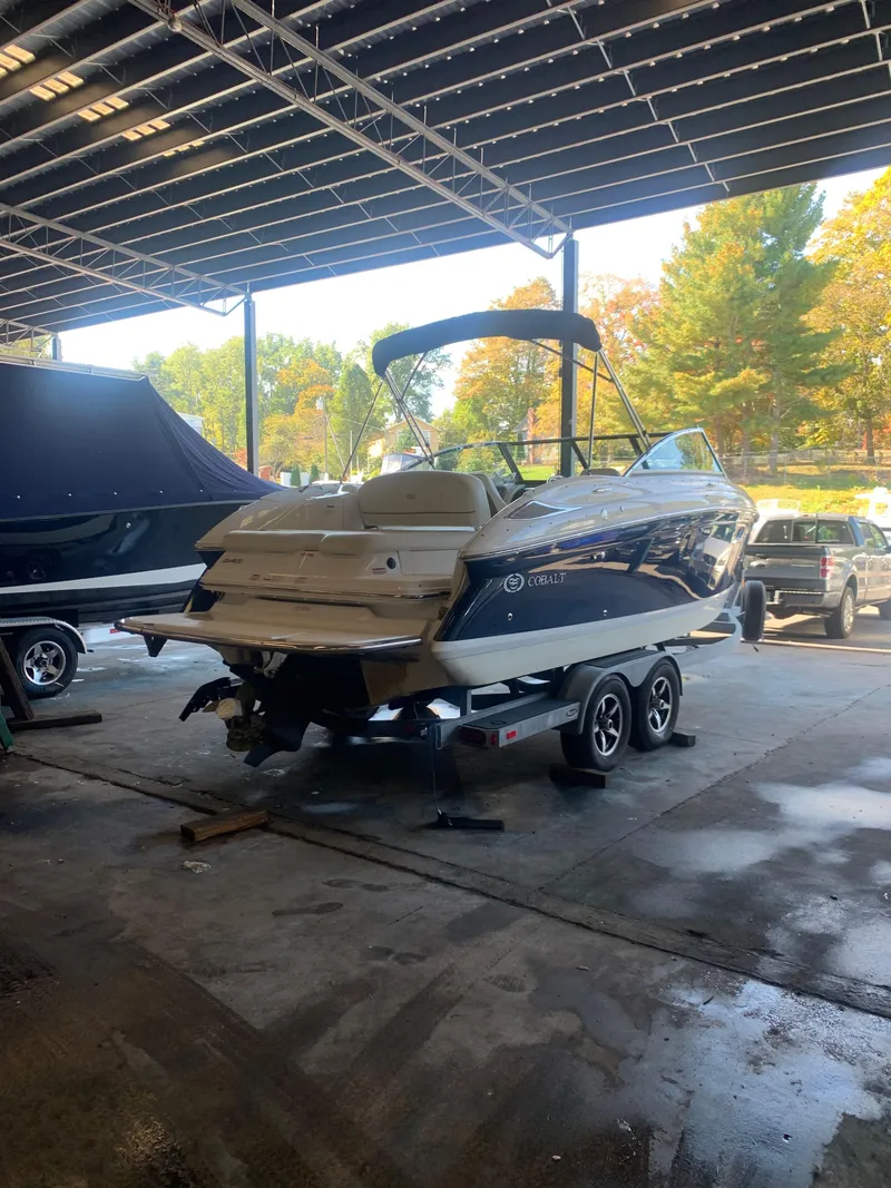 Slide: The Image of 2015 Cobalt 243 boat on trailer in storage facility. - 5