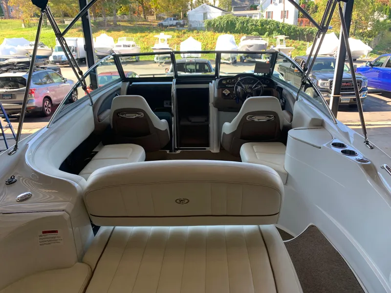 Slide: The Image of Interior of a 2015 Cobalt 243 boat with white seating. - 9