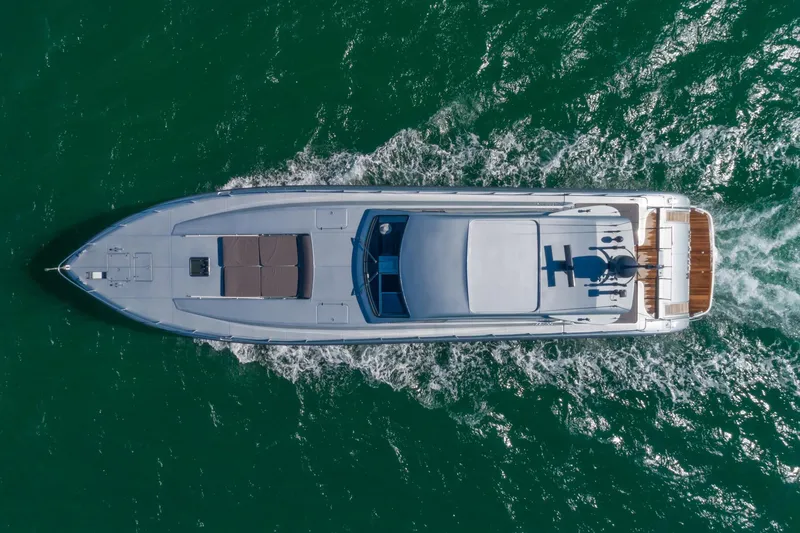 Slide: The Image of Aerial view of 2007 Leopard Express Motor Yacht cruising on green ocean waters. - 10