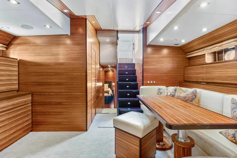 Slide: The Image of Luxurious interior of 2007 Leopard Express Motor Yacht with wood paneling and elegant seating. - 25