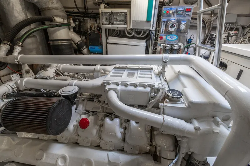 Slide: The Image of Engine room of a 2007 Leopard Express Motor Yacht, showcasing machinery and control panels. - 33