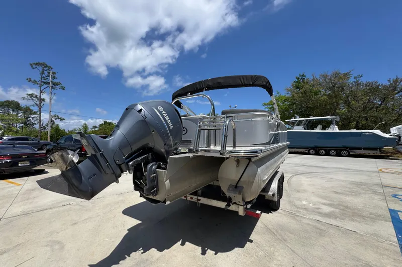 Slide: The Image of 2021 Avalon LSZ 2485 QL pontoon boat with Yamaha outboard motor on trailer. - 13