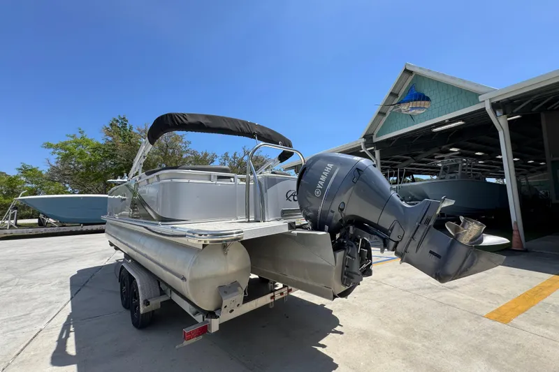 Slide: The Image of 2021 Avalon LSZ 2485 QL pontoon boat with Yamaha outboard motor on trailer. - 16