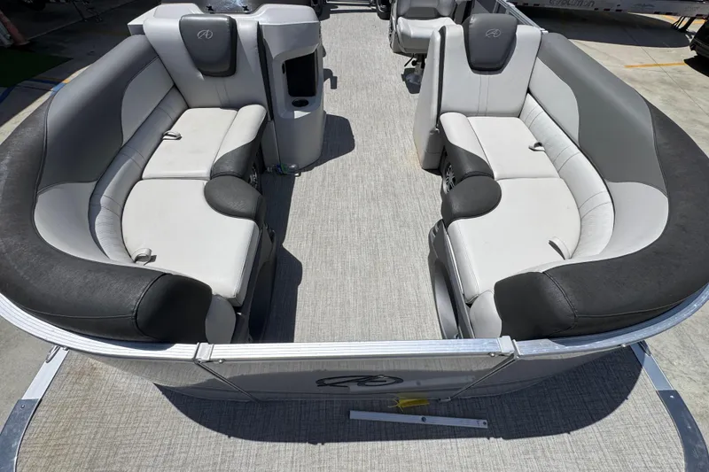 Slide: The Image of 2021 Avalon LSZ 2485 QL pontoon boat interior with gray seating and carpeted floor. - 18