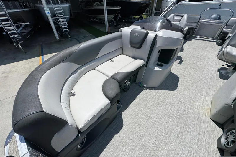 Slide: The Image of 2021 Avalon LSZ 2485 QL pontoon boat interior with gray seating and modern design. - 20